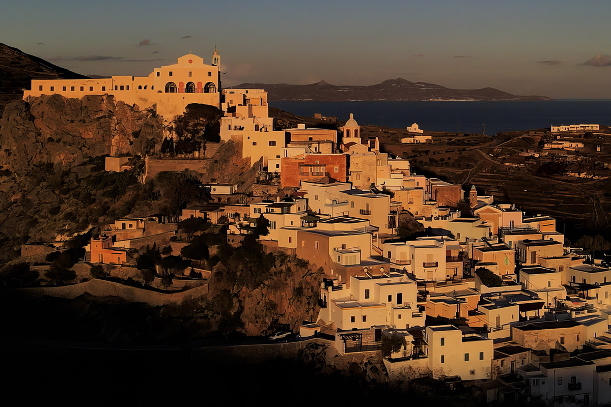 Cathedral of Agios Georgios in Ano Syros at dusk, overlooking Ermoupoli and the harbor below. Medieval settlement on the hill of San Giorgio, Syros.